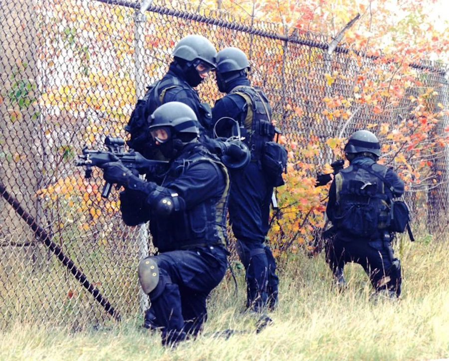 Four members of JTF2 dressed in combat gear