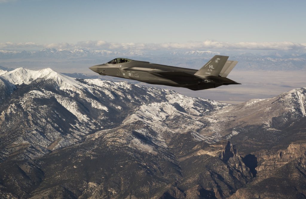 An F-35 aircraft soars over the mountains of Utah