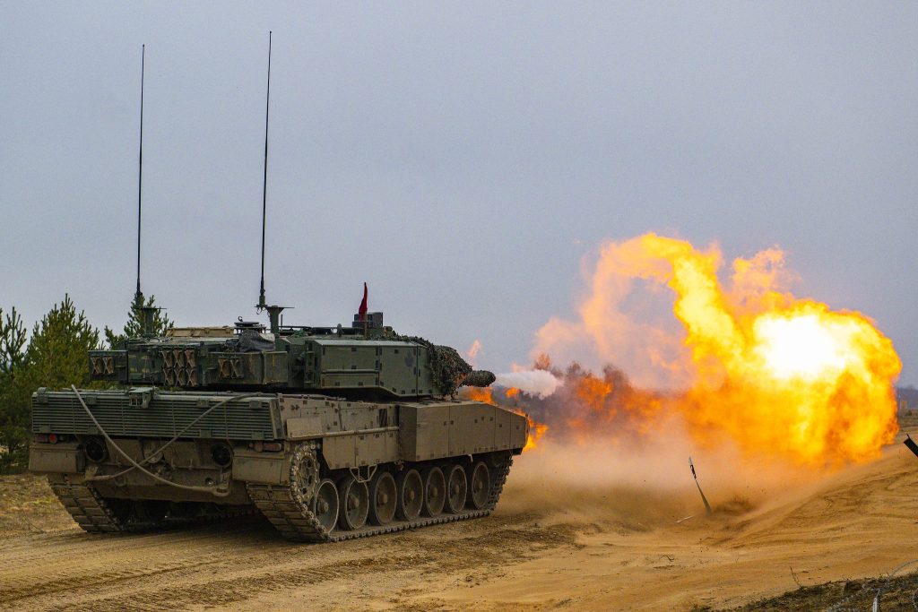 battle tank carrying members of the Canadian Armed Forces