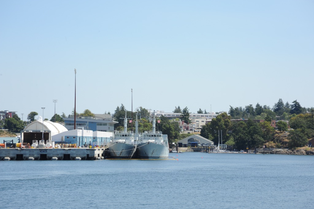 Two ships - known as MCDVs - are docked in a harbour.